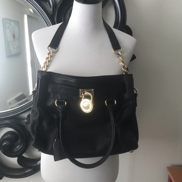 Michael Kors Handbags - Black leather and gold Michael Kors bag. Lock &key